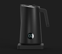 A black NanoFoamer PRO milk frother on a dark background, displaying a digital readout of temperature